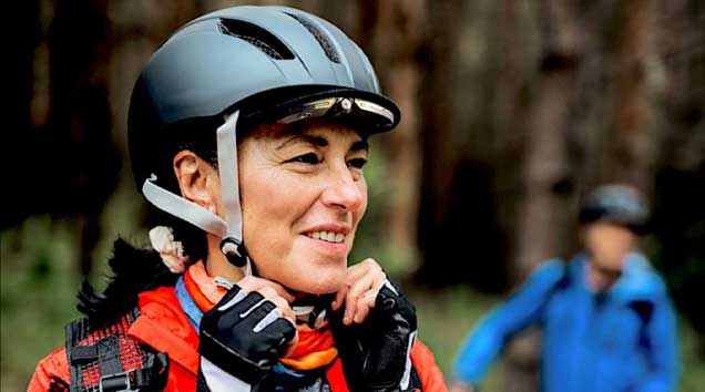 Woman on bike with Cambox helmet camera